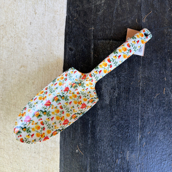 Aluminum Garden Spade with Floral Pattern, White, 10.5" featuring a colorful floral design, perfect for garden decor and practical planting tasks from Knotty and Board.