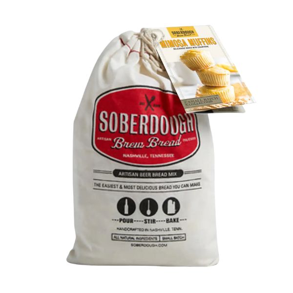 Bag of Soberdough Brew Bread, Mimosa Muffins artisan beer bread mix with a red logo, promoting handcrafted natural mix from Nashville, Tennessee, ideal for kitchen and entertaining gifts.