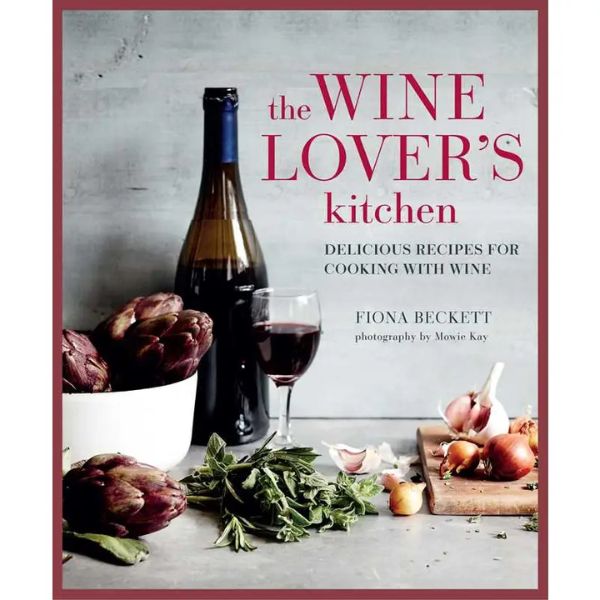 Cookbook cover titled Wine Lover's Kitchen featuring a bottle of red wine, a glass of wine, fresh artichokes, garlic, and herbs on a rustic kitchen surface, emphasizing kitchen decor and gifts.
