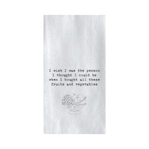 White tea towel with black printed text reading "I wish I was the person I thought I could be when I bought all these fruits and vegetables," featuring a simple line drawing of a bowl of fruit, part of kitchen decor and gifts from Knotty and Board.