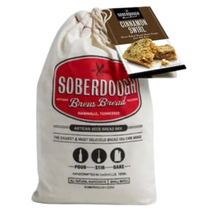 A cloth bag of Soberdough Brew Bread, Cinnamon Swirl artisan bread mix with a recipe card, displayed as a unique kitchen gift from Knotty and Board, perfect for entertaining and decor.