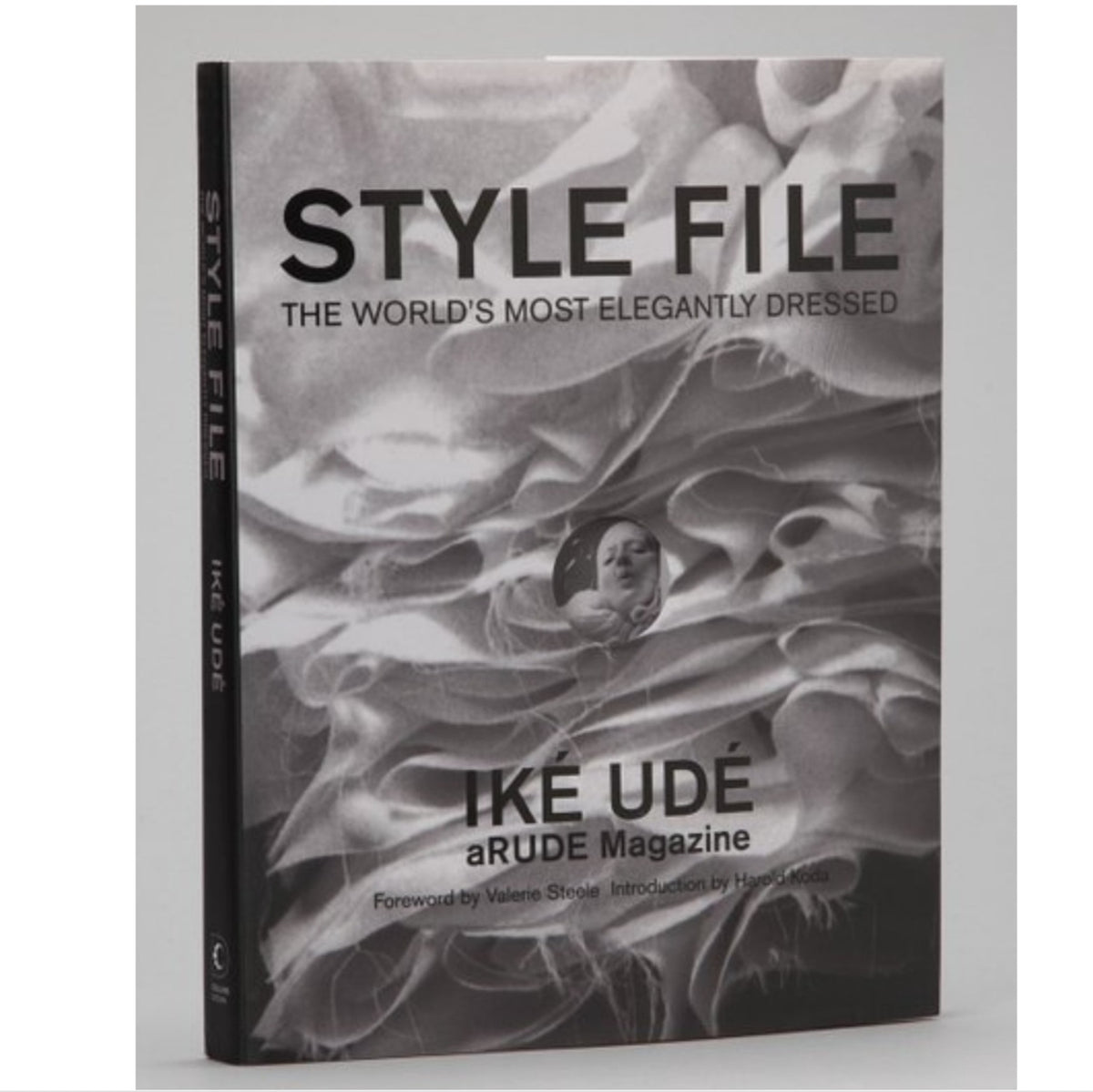 Style File book by Ike Udé displayed with abstract, flowing fabric-like cover design, ideal for decor and gifts from Knotty and Board, every room needs a little Knotty and Board.