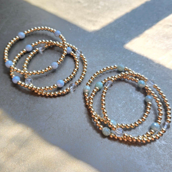 Morgan & Me 4mm 14k Gold Filled Bracelet with Asst Gemstones displayed on a smooth surface with natural light, perfect for gifts and jewelry enthusiasts at Knotty and Board.