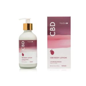 Yuzu Body Lotion, Lychee Blossom, 100mg in a clear bottle with a gold pump next to its matching pink and white box, perfect for curated decor and gifts from Knotty and Board.