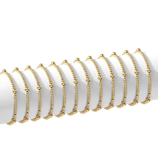 Multiple gold Stretch Bead Bracelet, 3mm & 5mm Accents, Gold, Priced individually, displayed on a white cylindrical stand, elegant jewelry gift option from Knotty and Board decor collection.