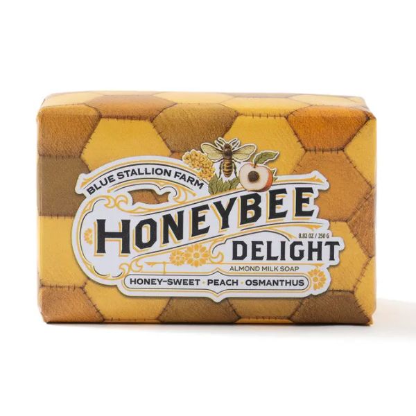 Blue Stallion Bar Soap, Honeybee Delight in honeycomb-patterned packaging featuring honey, peach, and osmanthus scents, perfect for artisanal gifts and charming decor by Knotty and Board.