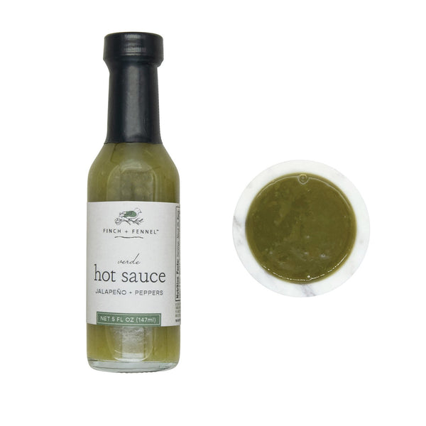 Bottle of Verde Hot Sauce, 5 oz with jalapeño and peppers flavor alongside a small dish of green hot sauce, perfect for kitchen or dining gifts from Knotty and Board.