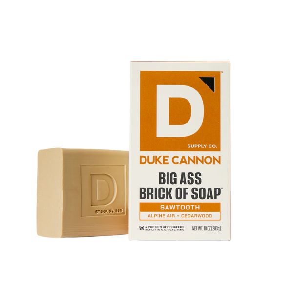 Duke Cannon Brick of Soap, 10 oz., Sawtooth with rugged beige brick soap next to white and orange labeled box, a unique gift for home decor and bathroom essentials from Knotty and Board.