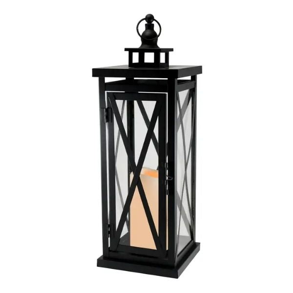 Black Crisscross Metal Lantern with a Battery Candle inside, perfect for cozy home decor or gifts, blending modern design with warm ambient lighting from Knotty and Board.