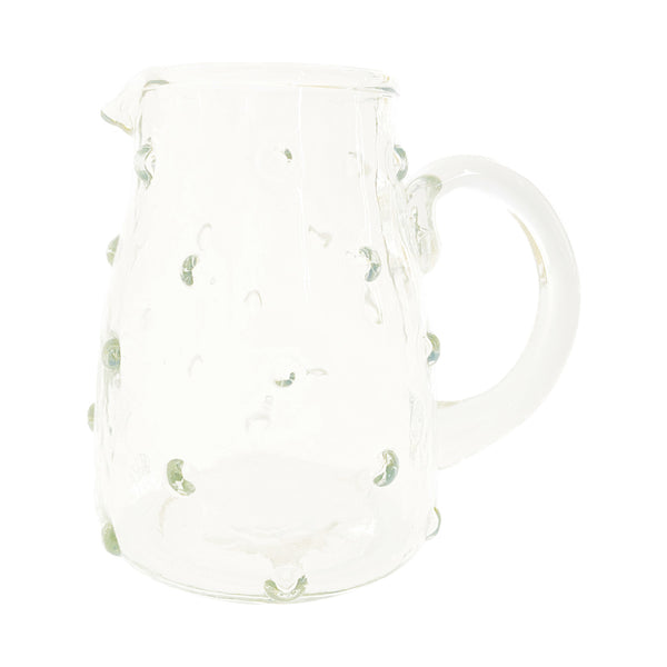 Clear glass creamer with hobnail texture and rounded handle, perfect for kitchen or dining decor, featuring the Recycled Glass Hobnail Creamer, 8 oz from Knotty and Board.