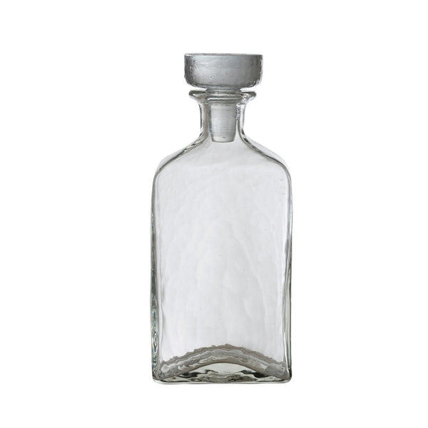 Clear Glass Decanter, 16 oz, with a textured surface and stopper, perfect for kitchen or dining decor and gifts from Knotty and Board. Every Room Needs A Little Knotty and Board.