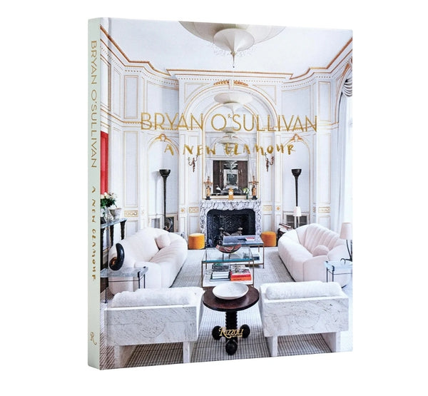 Bryan O'sullivan book featuring elegant interior decor with classic white and gold living room, perfect for stylish home design inspiration at Knotty and Board.