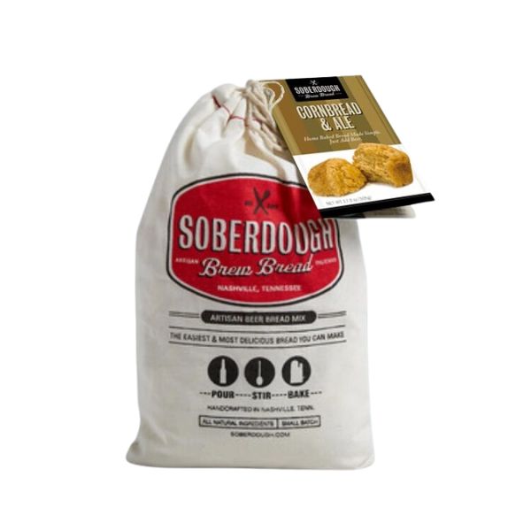 Cloth bag of Soberdough Brew Bread, Cornbread and Ale artisan beer bread mix with rustic packaging, perfect for kitchen gifts and entertaining from Knotty and Board.