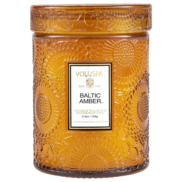 Voluspa Baltic Amber Small Jar Candle, 5.5oz, in an amber embossed glass jar, perfect for home decor, gifts, kitchen ambiance, and entertaining from Knotty and Board.