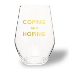 Clear stemless wine glass with gold foil text reading "COPING AND HOPING", perfect for dining and entertaining, featured by Knotty and Board in curated decor and gifts.