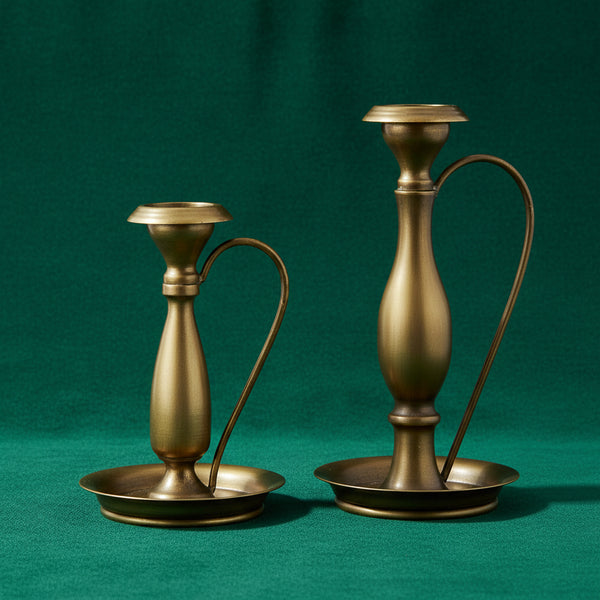 Two Traditional Bronze Metal Candle Holder, Small, 7 in. displayed side by side, showcasing elegant vintage-inspired decor perfect for dining or entertaining by Knotty and Board.