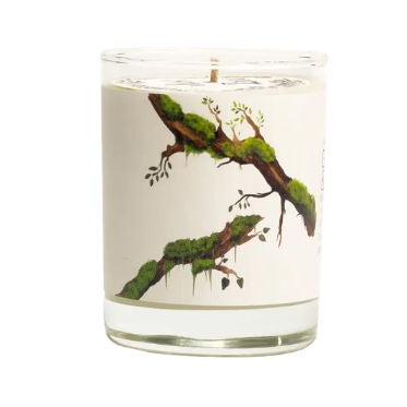 Just Bee Guaiac Wood & Moss, 13 oz candle in a clear glass container with a decorative label featuring green moss and wood branches, perfect for cozy decor and gifts from Knotty and Board.