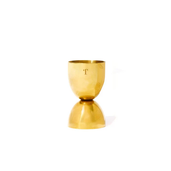 Bell Shaped Cocktail Jigger made of polished brass with a sleek, reflective surface, perfect for kitchen entertaining and stylish drink measuring from Knotty and Board.
