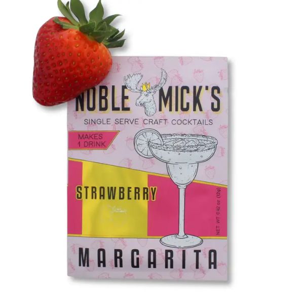 Noble Mick's Single Serve Craft Cocktail, Strawberry Margarita packaging next to a fresh strawberry, perfect for gifts and entertaining from Knotty and Board.
