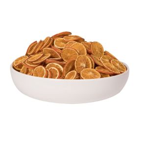 A white bowl filled with a large pile of Dried Orange Slices, Single, ideal for kitchen decor, entertaining, or gifting from Knotty and Board.